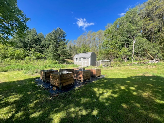 S363 Nicholes Rd, Naples Twp, WI 54755 - view of grassy yard featuring a forest view and a garden