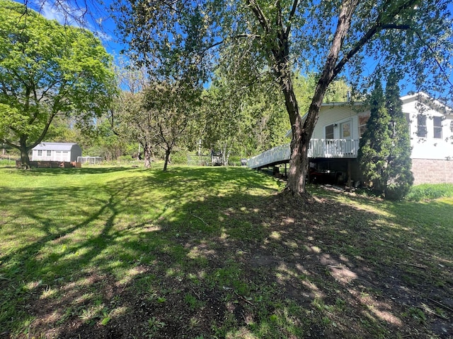 S363 Nicholes Rd, Naples Twp, WI 54755 - view of grassy yard with a deck