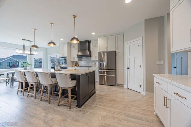 3340 2nd St E, West Fargo, ND 58078 - kitchen with appliances with stainless steel finishes, custom range hood, a kitchen breakfast bar, an island with sink, and backsplash