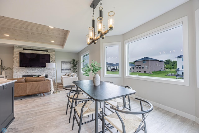3340 2nd St E, West Fargo, ND 58078 - dining area with a raised ceiling, recessed lighting, baseboards, light wood-type flooring, and a chandelier