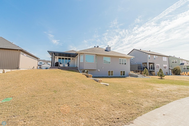 3340 2nd St E, West Fargo, ND 58078 - back of property with a lawn and a chimney