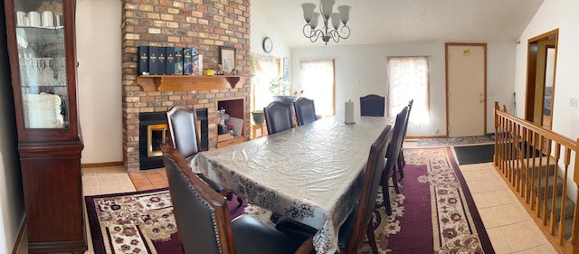 1272 Burke Ave E, Maplewood, MN 55109 - dining room with vaulted ceiling, light tile patterned floors, a fireplace, and a chandelier