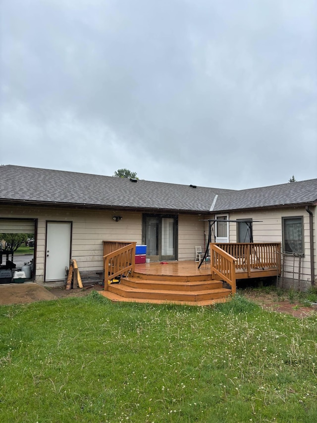 1272 Burke Ave E, Maplewood, MN 55109 - back of house featuring a deck, a yard, and roof with shingles