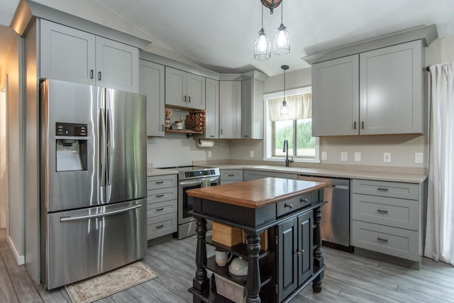 7903 Long Lake Bay Rd, Brainerd, MN 56401 - kitchen featuring appliances with stainless steel finishes, open shelves, a sink, light wood-type flooring, and decorative light fixtures