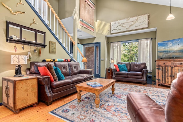 2195 Bayview Pl, Orono, MN 55391 - living room featuring hardwood / wood-style flooring, stairs, and a high ceiling