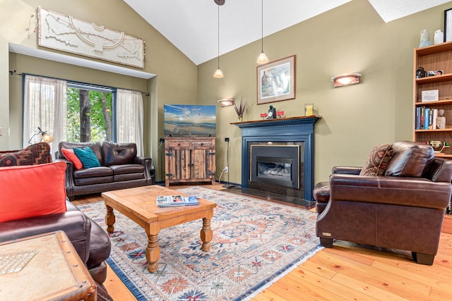 2195 Bayview Pl, Orono, MN 55391 - living room featuring hardwood / wood-style flooring, a fireplace with flush hearth, and high vaulted ceiling