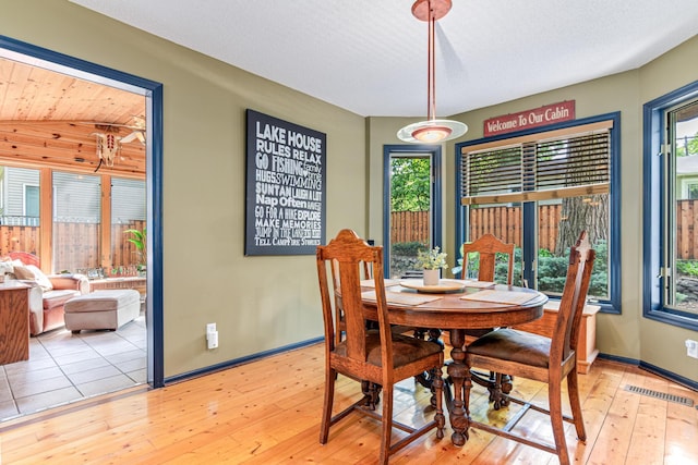 2195 Bayview Pl, Orono, MN 55391 - dining space with hardwood / wood-style flooring, plenty of natural light, and baseboards