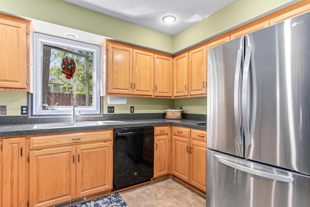 2195 Bayview Pl, Orono, MN 55391 - kitchen featuring freestanding refrigerator, black dishwasher, a sink, and a textured ceiling