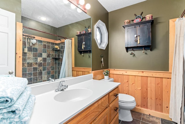 2195 Bayview Pl, Orono, MN 55391 - bathroom with a wainscoted wall, toilet, vanity, tile patterned flooring, and a shower with curtain