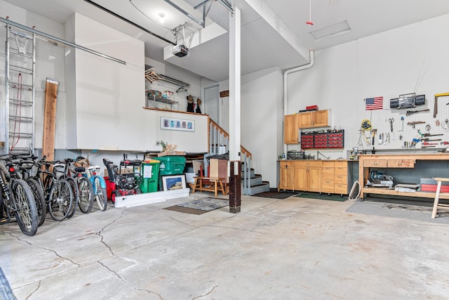 2195 Bayview Pl, Orono, MN 55391 - garage with a workshop area and a garage door opener