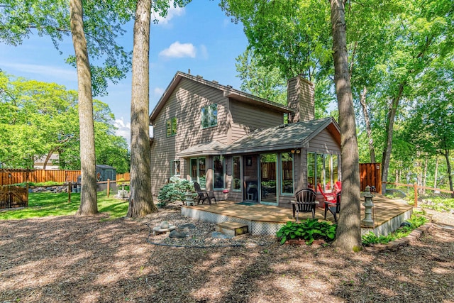 2195 Bayview Pl, Orono, MN 55391 - rear view of property with a chimney and a deck