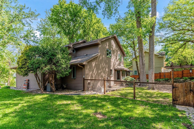 2195 Bayview Pl, Orono, MN 55391 - rear view of property featuring central AC and a gate