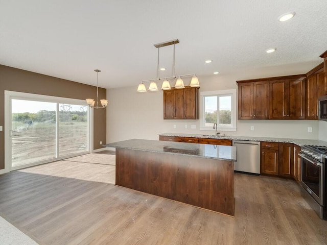 967 206th Ave NW, Oak Grove, MN 55011 - kitchen featuring appliances with stainless steel finishes, a kitchen island, healthy amount of natural light, a chandelier, and recessed lighting