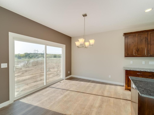 967 206th Ave NW, Oak Grove, MN 55011 - unfurnished dining area with baseboards, a chandelier, light wood-style flooring, and recessed lighting
