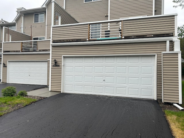 10946 Johnson St NE, Blaine, MN 55434 - garage featuring asphalt driveway