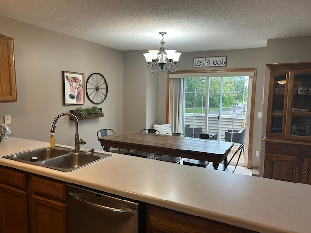 10946 Johnson St NE, Blaine, MN 55434 - kitchen with dishwasher, a sink, a chandelier, light countertops, and pendant lighting