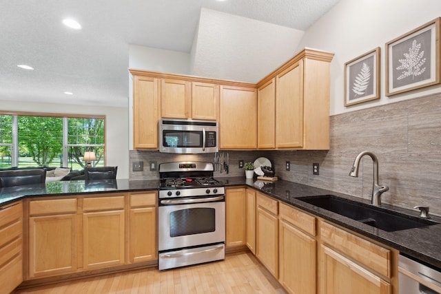 2658 133rd St W, Rosemount, MN 55068 - kitchen featuring stainless steel appliances, a sink, light brown cabinets, decorative backsplash, and recessed lighting
