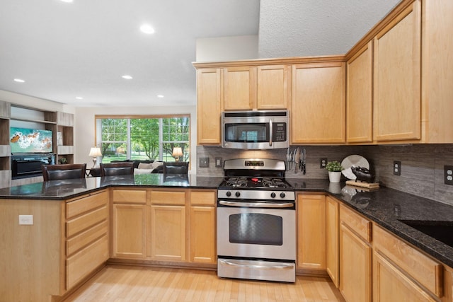 2658 133rd St W, Rosemount, MN 55068 - kitchen featuring stainless steel appliances, light brown cabinetry, a peninsula, light wood-type flooring, and backsplash