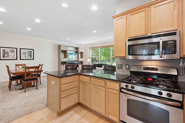 2658 133rd St W, Rosemount, MN 55068 - kitchen with appliances with stainless steel finishes, light brown cabinets, a peninsula, recessed lighting, and light wood finished floors