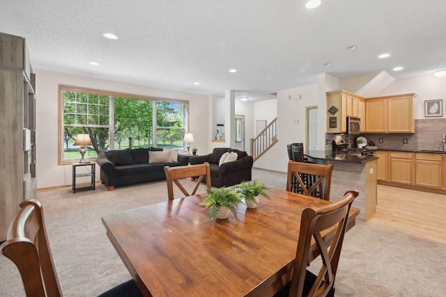 2658 133rd St W, Rosemount, MN 55068 - dining area with light colored carpet, stairs, recessed lighting, and baseboards