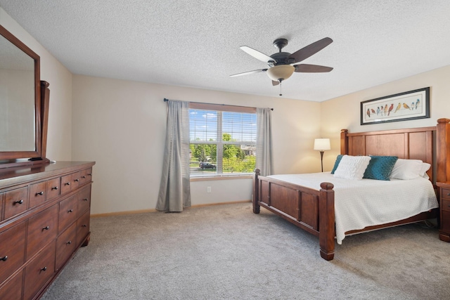 2658 133rd St W, Rosemount, MN 55068 - bedroom featuring a textured ceiling, light carpet, baseboards, and a ceiling fan
