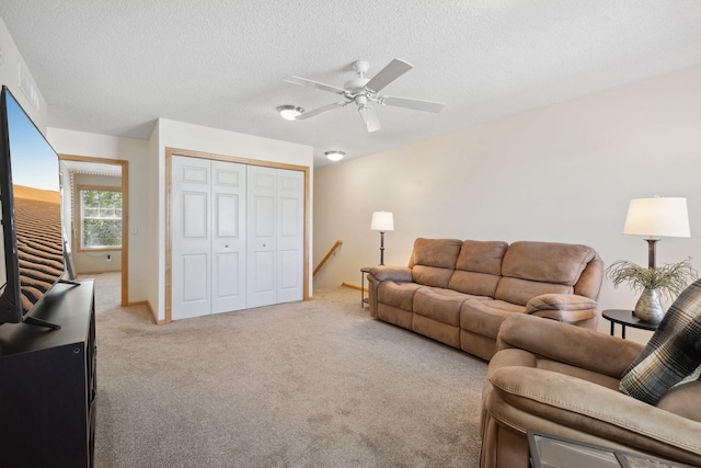 2658 133rd St W, Rosemount, MN 55068 - living room with ceiling fan, light carpet, and a textured ceiling