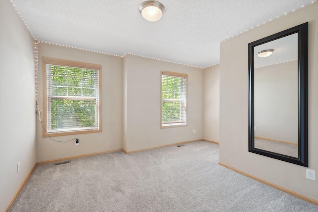 2658 133rd St W, Rosemount, MN 55068 - carpeted empty room with baseboards and a textured ceiling