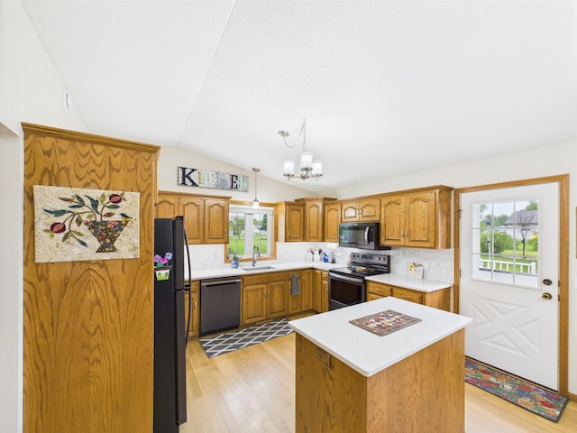 625 7th St NW, Richmond, MN 56368 - kitchen featuring stainless steel appliances, lofted ceiling, brown cabinetry, light wood-type flooring, and backsplash