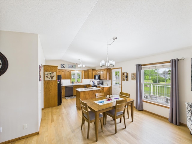 625 7th St NW, Richmond, MN 56368 - dining room with a chandelier, light wood finished floors, lofted ceiling, and baseboards