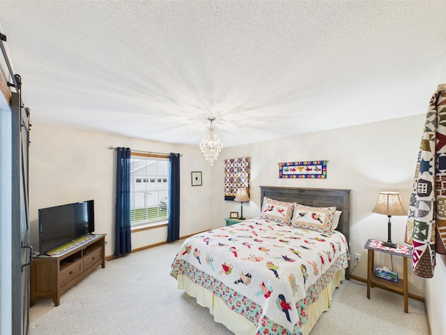 625 7th St NW, Richmond, MN 56368 - bedroom with a chandelier, a textured ceiling, light colored carpet, baseboards, and a barn door