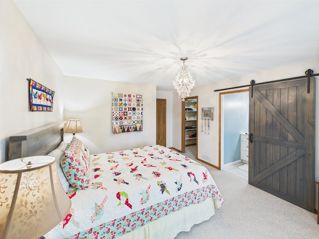 625 7th St NW, Richmond, MN 56368 - carpeted bedroom with a chandelier, a barn door, and baseboards