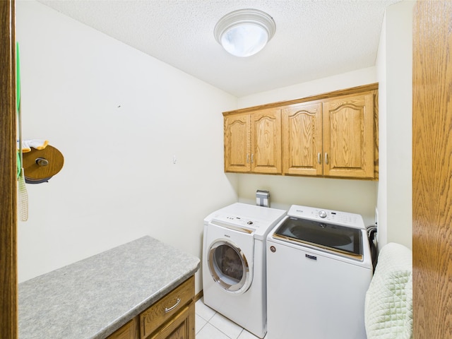 625 7th St NW, Richmond, MN 56368 - laundry area with cabinet space, washing machine and clothes dryer, light tile patterned floors, and a textured ceiling