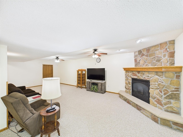 625 7th St NW, Richmond, MN 56368 - carpeted living room with a fireplace, baseboards, a textured ceiling, and ceiling fan