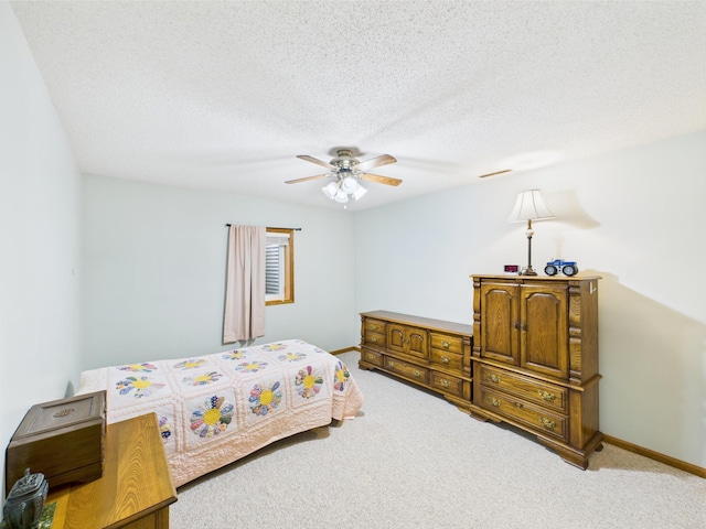 625 7th St NW, Richmond, MN 56368 - bedroom with carpet flooring, ceiling fan, baseboards, and a textured ceiling