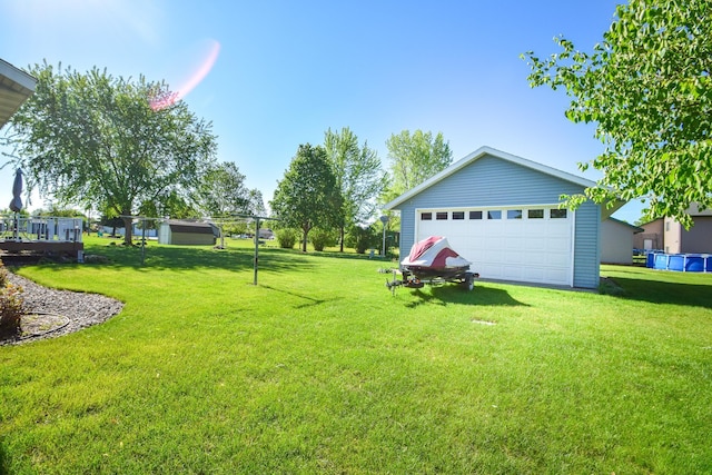 625 7th St NW, Richmond, MN 56368 - view of green lawn with a garage and an outbuilding