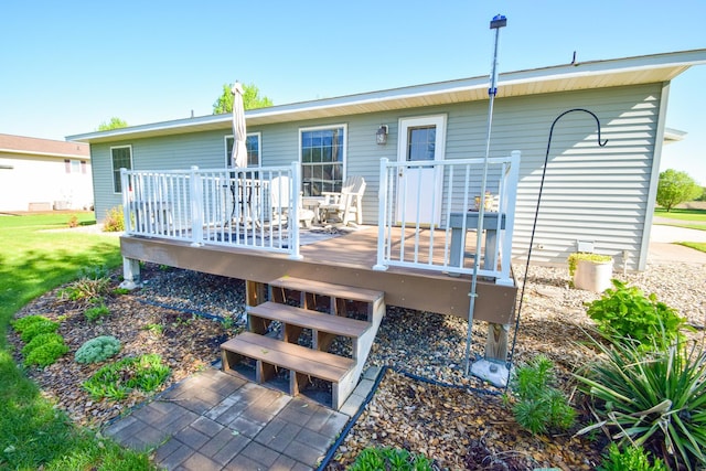 625 7th St NW, Richmond, MN 56368 - back of house featuring a deck