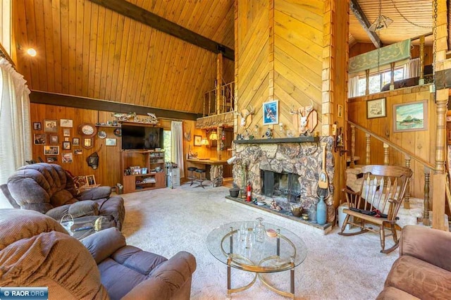 3240 Breezy Point Rd, Tower, MN 55790 - carpeted living area with wood walls, high vaulted ceiling, wood ceiling with exposed beams, and a stone fireplace