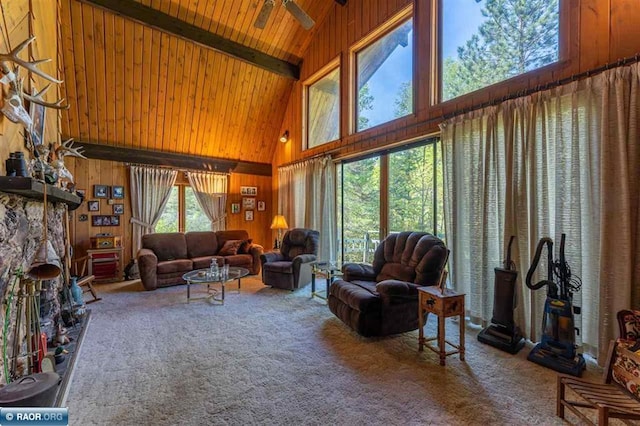3240 Breezy Point Rd, Tower, MN 55790 - living room featuring high vaulted ceiling, carpet floors, wood walls, and wooden ceiling with exposed beams