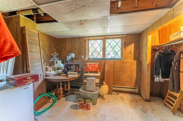3240 Breezy Point Rd, Tower, MN 55790 - below grade area with wood walls and a baseboard radiator