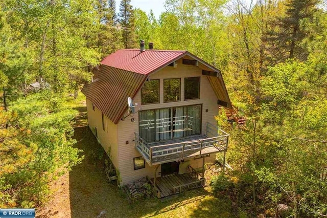 3240 Breezy Point Rd, Tower, MN 55790 - back of property featuring a forest view, metal roof, and a standing seam roof