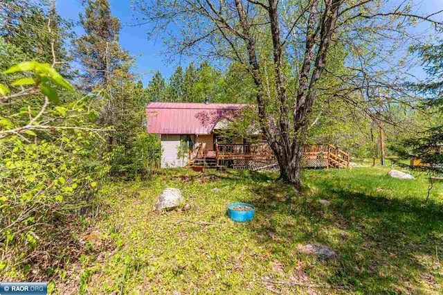 3240 Breezy Point Rd, Tower, MN 55790 - view of grassy yard featuring a deck