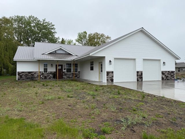 105 7th St, Hoffman, MN 56339 - single story home featuring stone siding, a garage, driveway, and metal roof