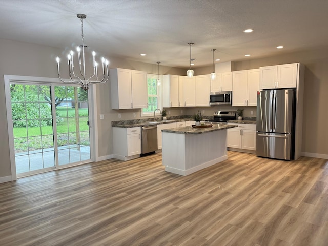 105 7th St, Hoffman, MN 56339 - kitchen with appliances with stainless steel finishes, a sink, baseboards, recessed lighting, and white cabinets