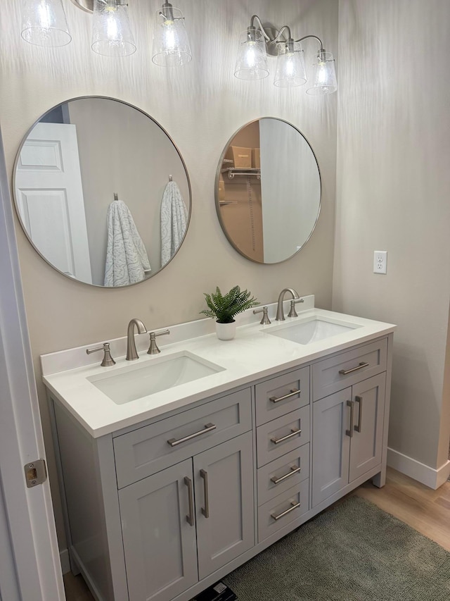 105 7th St, Hoffman, MN 56339 - full bathroom featuring double vanity and baseboards