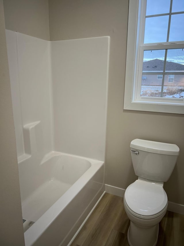 105 7th St, Hoffman, MN 56339 - full bath with baseboards, wood finished floors, and toilet