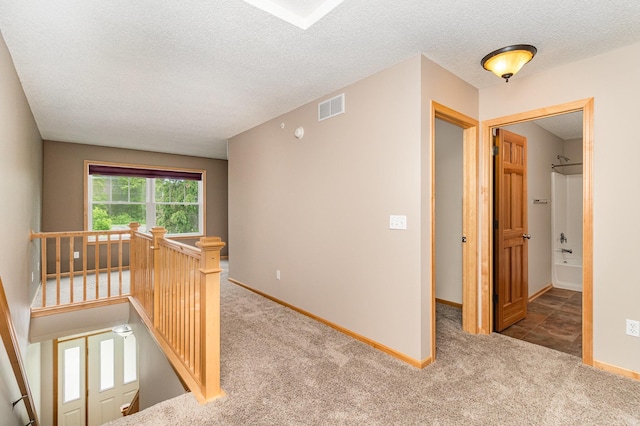 7275 Manning Ave N, Stillwater, MN 55082 - hall featuring an upstairs landing, carpet floors, a textured ceiling, and baseboards