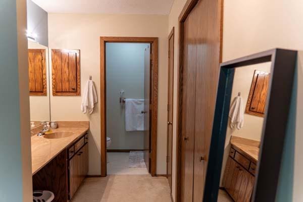 9826 Brighton Ln, Eden Prairie, MN 55347 - bathroom featuring vanity and toilet