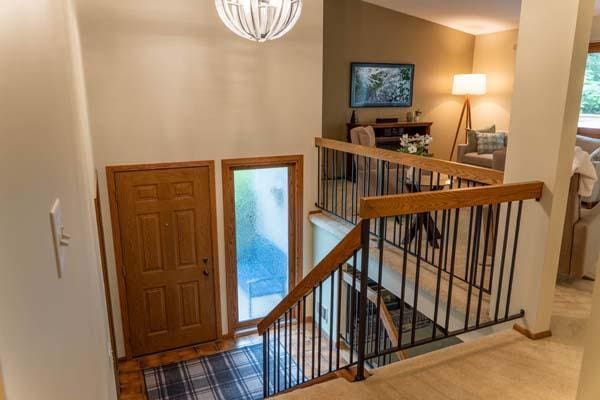 9826 Brighton Ln, Eden Prairie, MN 55347 - entryway with a chandelier and baseboards