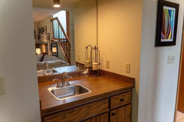 9826 Brighton Ln, Eden Prairie, MN 55347 - bar area with a sink and stairs