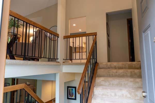 9826 Brighton Ln, Eden Prairie, MN 55347 - stairway with lofted ceiling